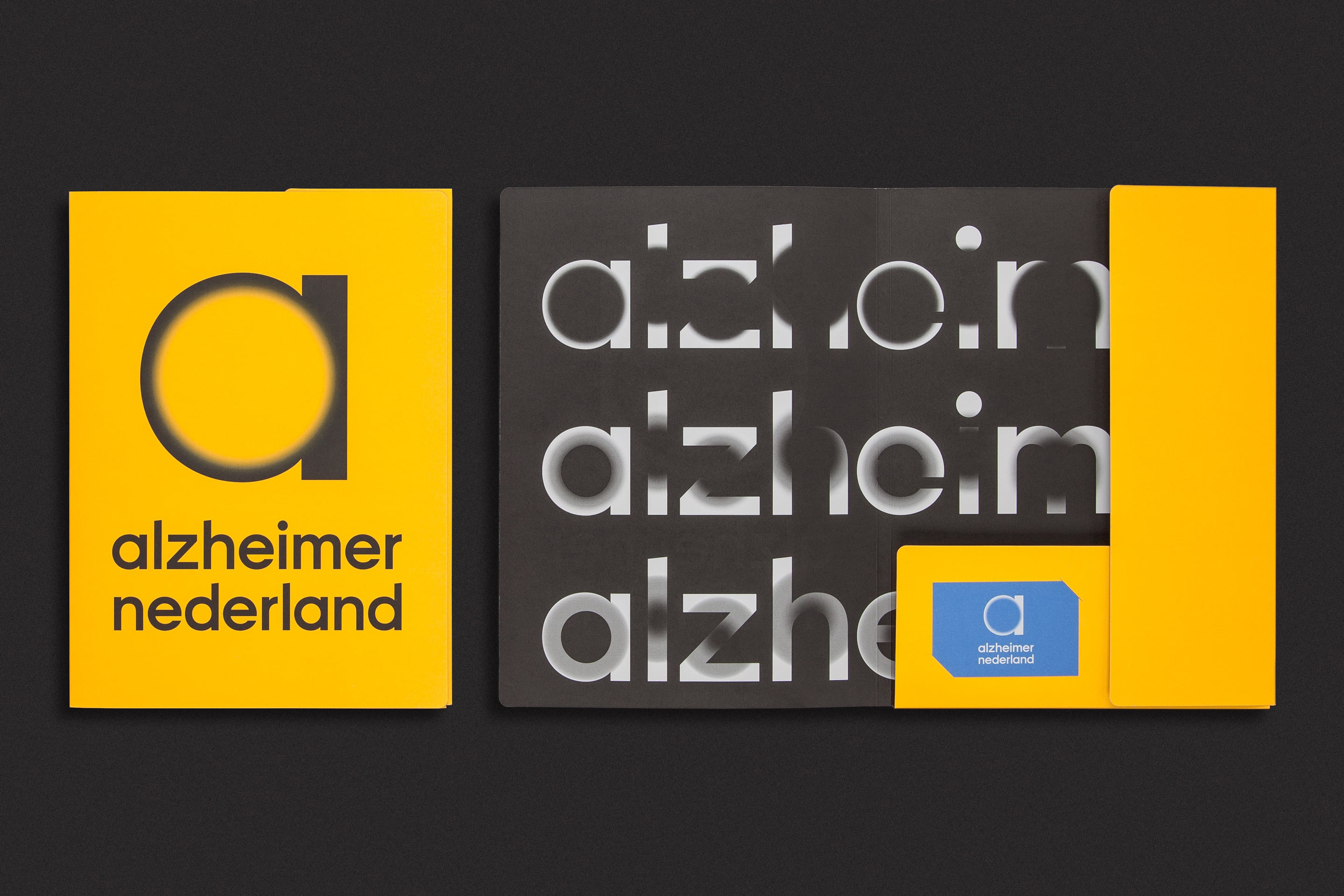 studio dumbar Alzheimer Nederland Brand identity folder design with fading typography and logo