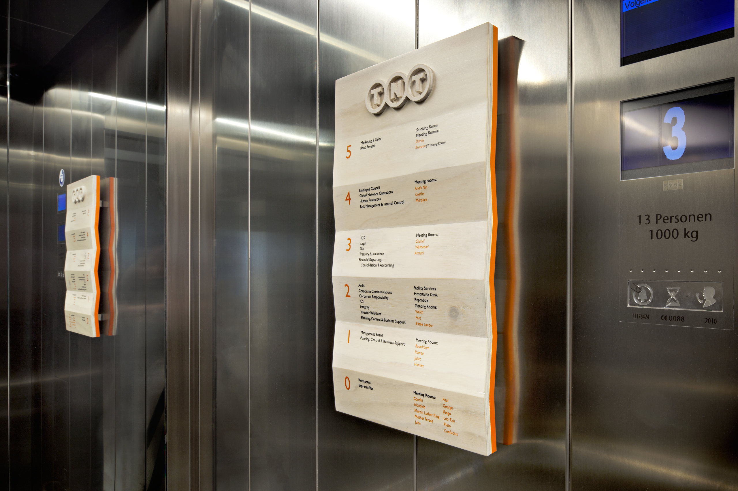 studio dumbar designs sustainable signage for TNT Green Office headquarters signage in lift